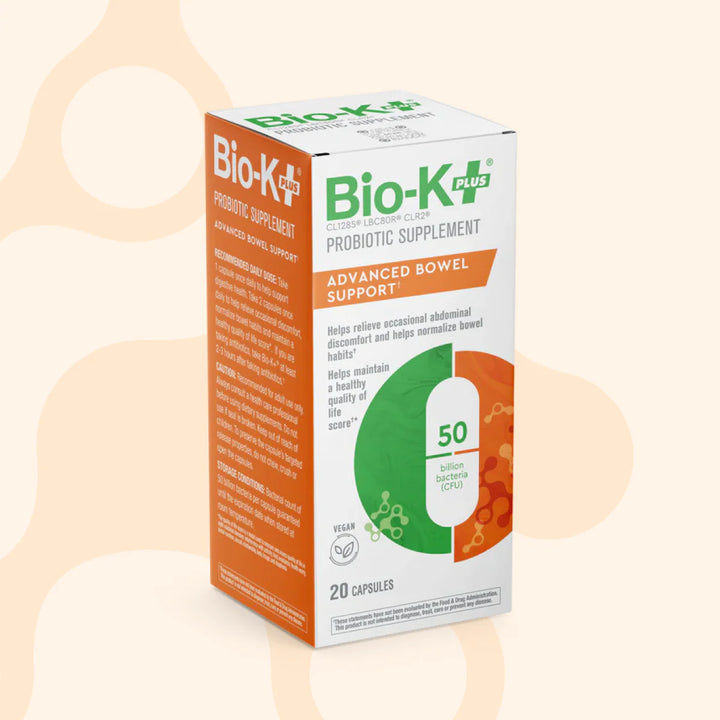 Bio-K+ probiotic supplement box on a beige background